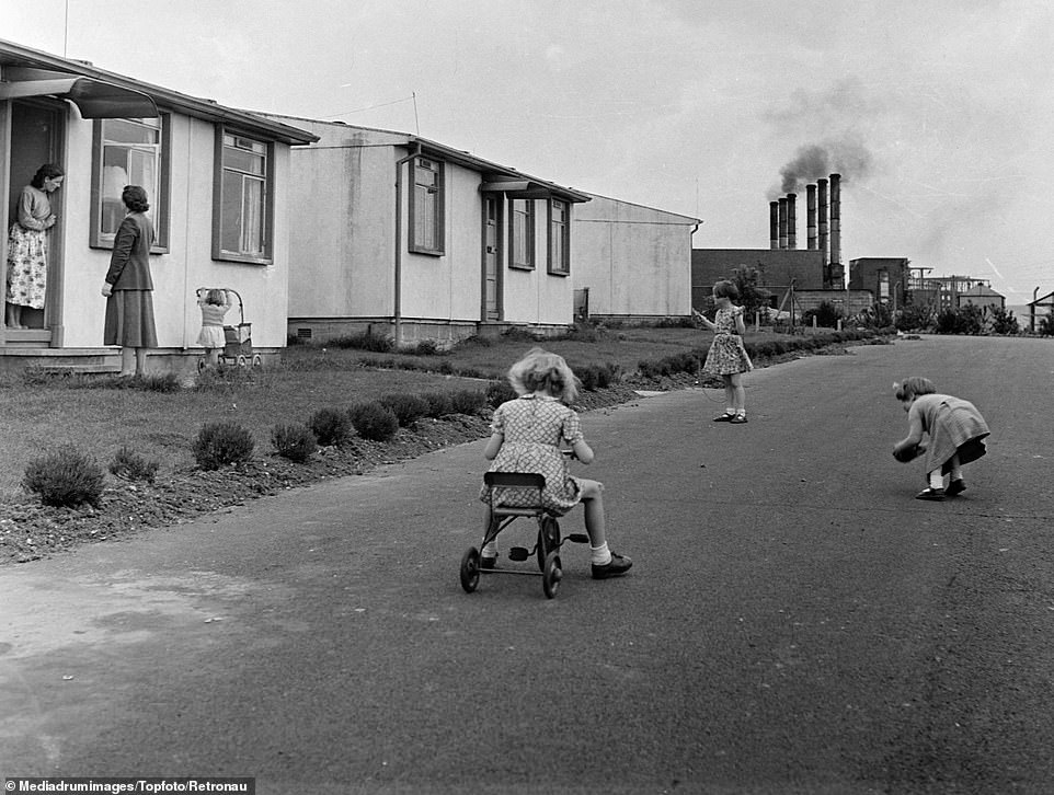 Children play in the streets outside their basic prefab accommodation at the Atomic Energy Research Establishment AERE in Harwell