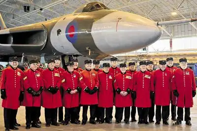 Chelsea Pensioners underneath the wings of the Vulcan bomber at RAF Lyneham March 2011